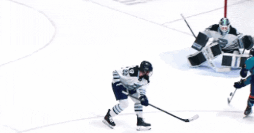 a hockey game is being played in front of an ad for keybank