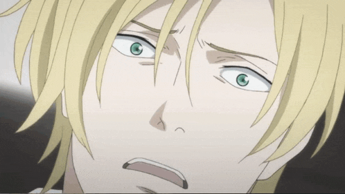 a close up of a person 's face with yellow hair