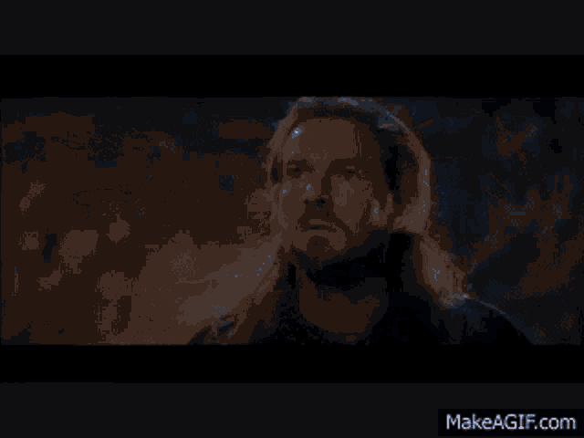 a blue light is coming out of a black background