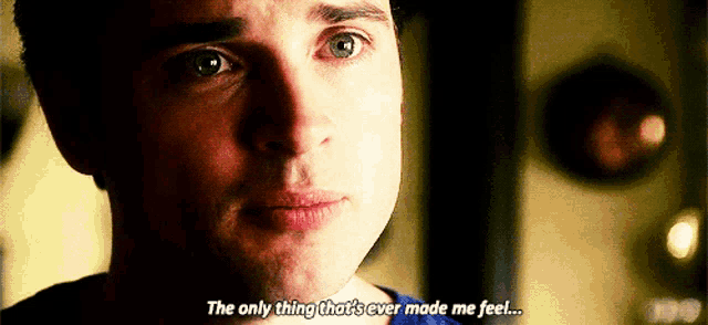 a close up of a man 's face with the words " the only thing that 's ever made me feel " visible