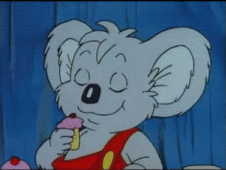 a cartoon koala bear is eating a pink cupcake