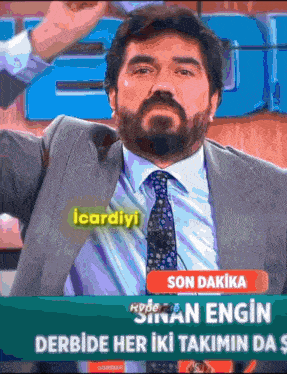 a man in a suit and tie is on a screen that says ' son dakika '