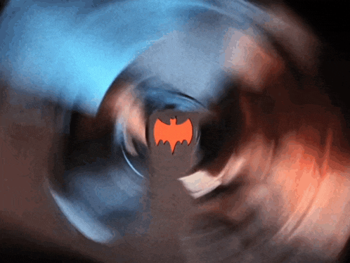 a bat logo is visible in the middle of a spinning object