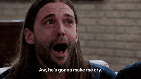 a man with long hair and a beard is crying and says aw he 's gonna make me cry