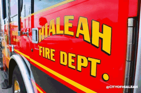 a red and yellow fire truck from the city of hialeah
