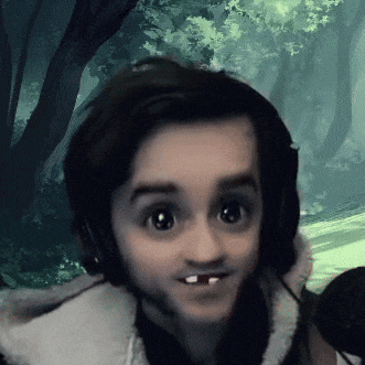 a close up of a child 's face with headphones and missing teeth