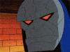 a close up of a cartoon character with red eyes