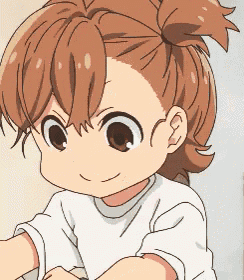 a close up of a child 's face with brown hair and a white shirt