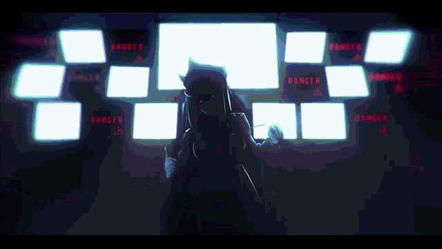 a person standing in front of a screen that says danger on it