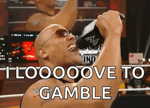 a man in a wrestling ring with the words " i looooove to gamble "