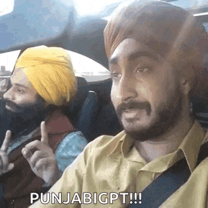 two men in turbans are sitting in a car and one of them is giving a thumbs up .
