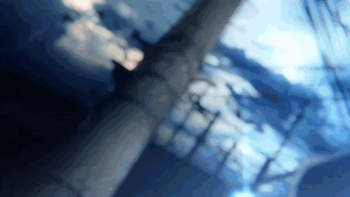 a blurry picture of a person 's teeth with a blue sky in the background