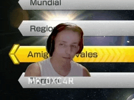 a man wearing headphones is standing in front of a screen that says ' mundial '