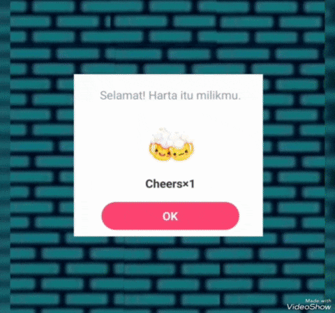 a blue brick wall with a pink button that says cheersx1