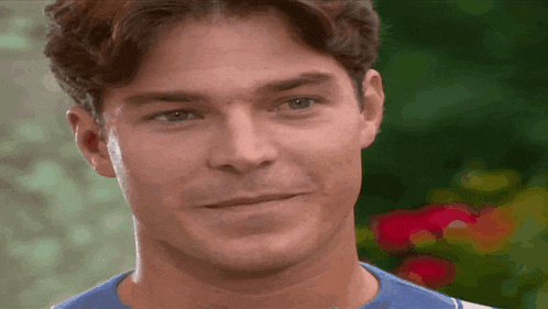 a close up of a man 's face with a blurred background