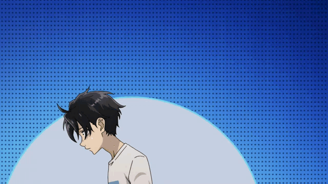 a boy with black hair is standing in front of a blue background with white dots