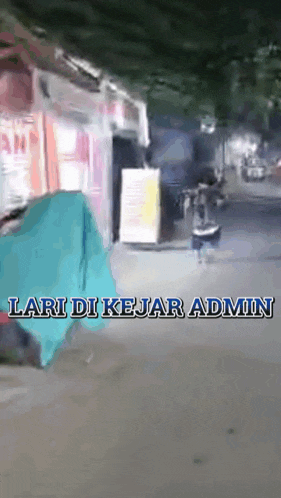 a person is walking down a street with the words lari di kejar admin written on the bottom