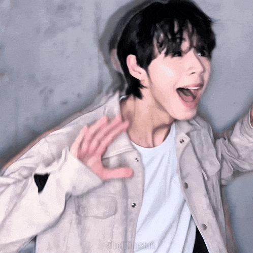 a person with their mouth open and a white shirt with the word ahotdimsum on it