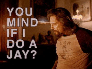 a man wearing a shirt that says ' you mind if i do a jay ' on it