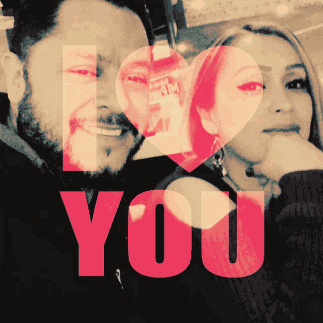 a man and a woman are standing next to each other with the words " i love you " behind them