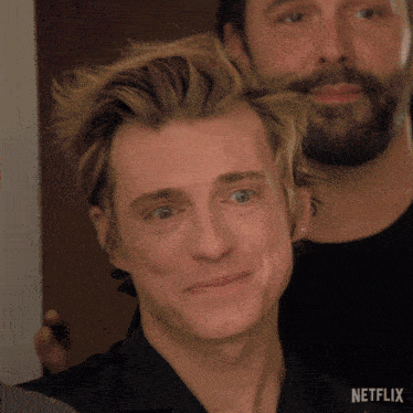 a close up of a man 's face with netflix written on the bottom right