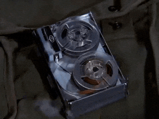 a close up of a tape recorder with two reels of tape in it