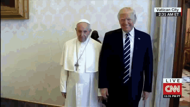 the pope and president trump are standing next to each other