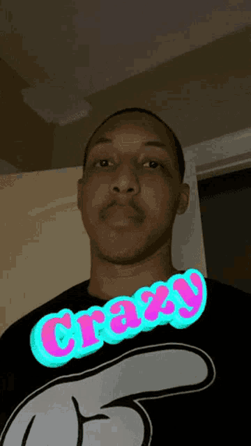 a man is wearing a shirt that says crazy
