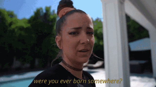 a woman with a choker on her neck is asking if she was ever born somewhere