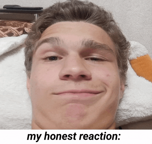 a close up of a man 's face with the caption " my honest reaction "