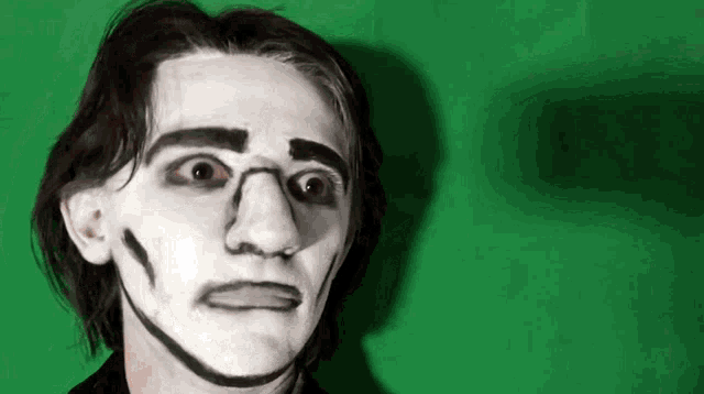 a man with his face painted like a cartoon character