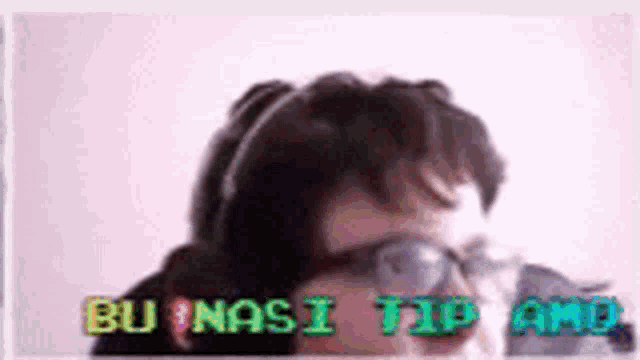 a man wearing glasses and headphones with the words bu nasi tip and bu nasi tip and bu nasi tip and bu nasi tip and bu nasi tip and
