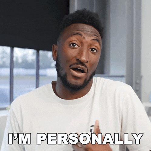 a man in a white shirt says " i 'm personally " in front of a window