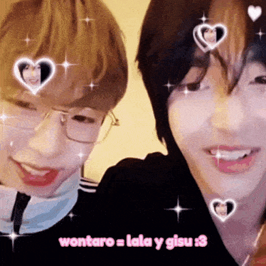 two boys with hearts on their faces and the words wontaro = lala y gisu 3 below them