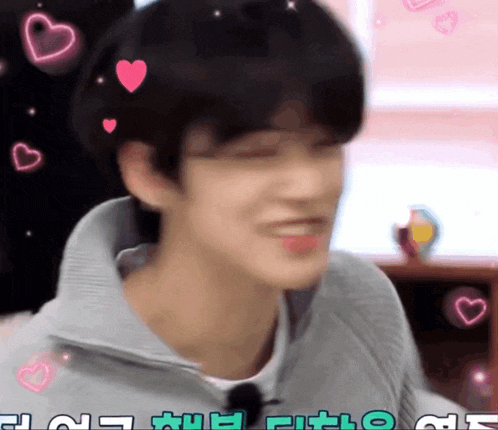 a close up of a person 's face with hearts on it