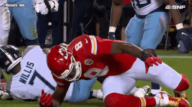 a football player named willis is laying on the ground
