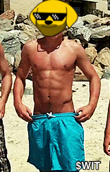 a shirtless man wearing blue shorts has a yellow smiley face on his face