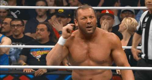 a wrestler in a ring with a la hat on