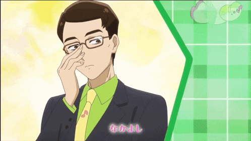 a man with glasses and a green shirt is covering his nose