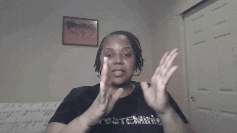 a woman wearing a black t-shirt that says " determine "