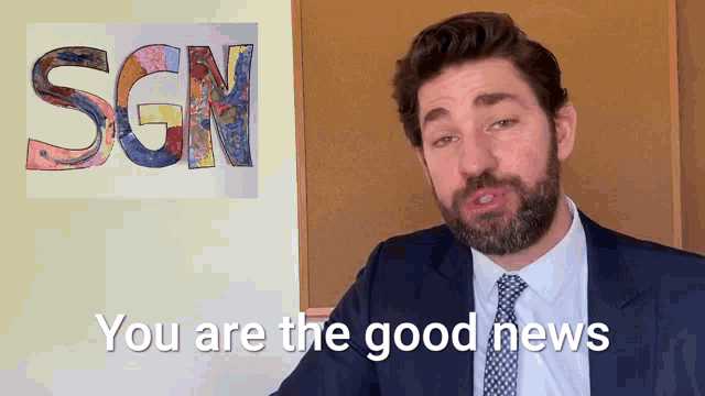 a man in a suit and tie is saying you are the good news