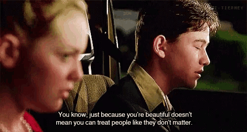a man and a woman are sitting in a car and the man says you know just because you are beautiful