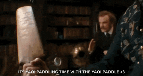 a person is holding a piece of paper in their hand with the words `` its yaoi paddling time with the yaoi paddle ''
