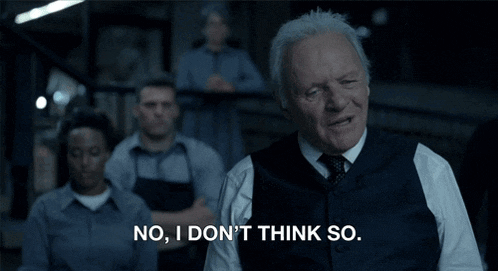 a man says " no i don 't think so " in front of a group of men