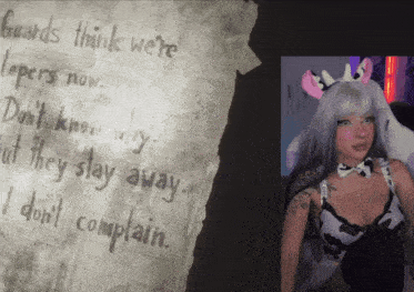 a girl in a cow costume is next to a piece of paper that says guards think we 're sleepers now