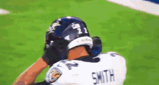 a football player with the name smith on the back of his shirt