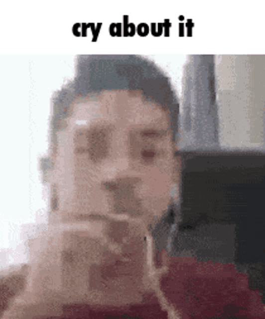 a man is taking a picture of himself with a cell phone and crying .