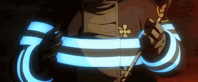 a close up of a person holding a glowing sword in their hands .