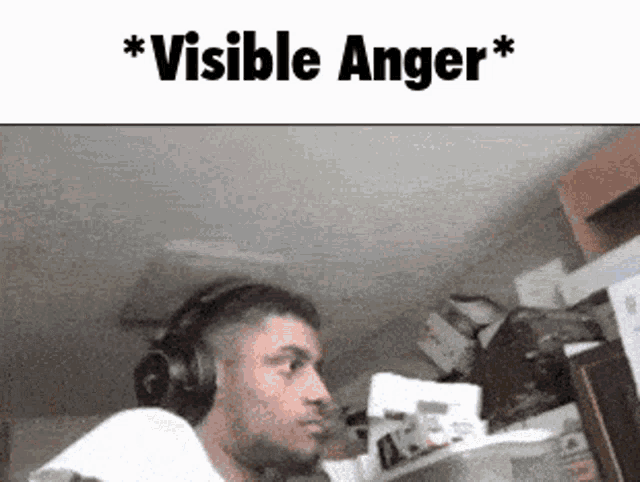 a man wearing headphones with the words visible anger on the bottom