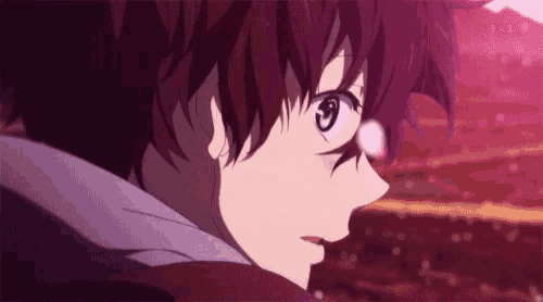 a close up of a person 's face with red hair and a purple shirt .